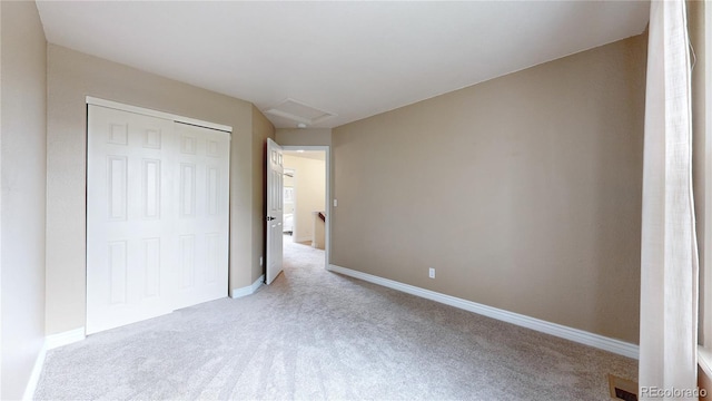 11301 Vernon Way, Parker, CO 80134 - unfurnished bedroom featuring carpet flooring, a closet, baseboards, and attic access
