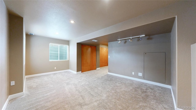 11301 Vernon Way, Parker, CO 80134 - unfurnished room featuring track lighting, light colored carpet, baseboards, and recessed lighting