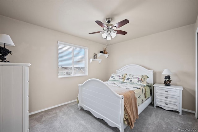 bedroom featuring dark colored carpet and ceiling fan