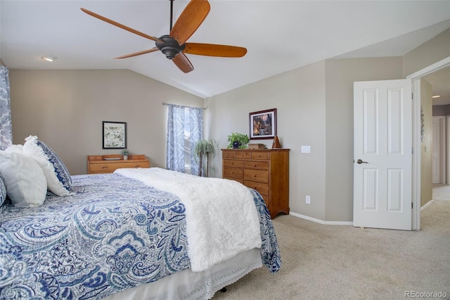 carpeted bedroom featuring ceiling fan and vaulted ceiling