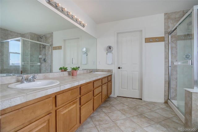 bathroom with tile patterned floors, walk in shower, and vanity