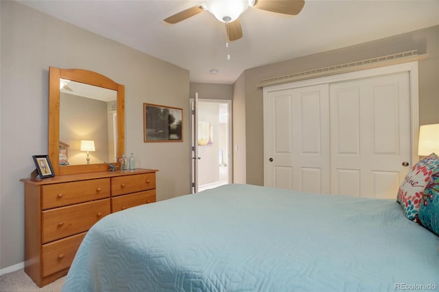 carpeted bedroom with a closet and ceiling fan