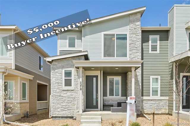 view of front of home featuring stone siding