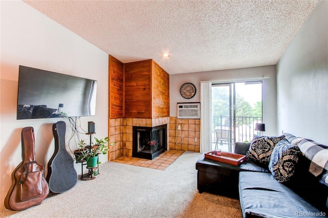 2280 S Oswego Way Unit 303, Aurora, CO 80014 - living area featuring carpet, a fireplace, a wall mounted air conditioner, and a textured ceiling
