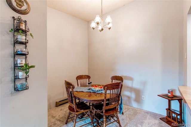 2280 S Oswego Way Unit 303, Aurora, CO 80014 - carpeted dining area featuring a chandelier and a baseboard radiator
