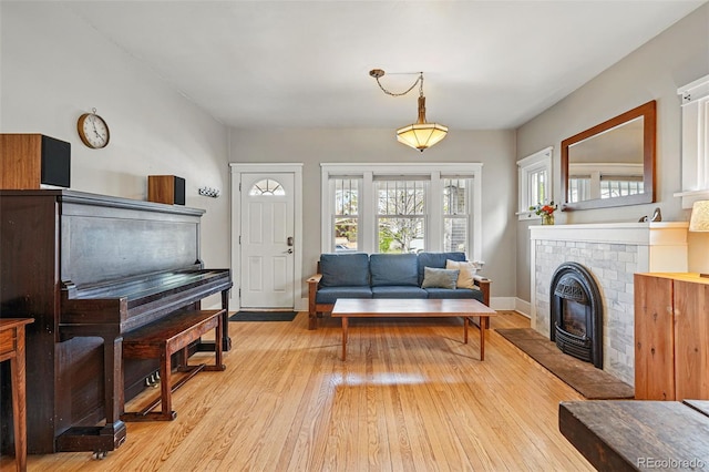 living room with light wood finished floors and baseboards