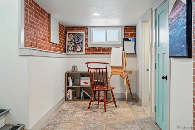 office area with baseboards and wood finished floors