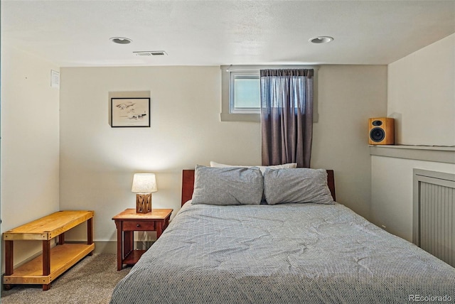 carpeted bedroom featuring visible vents and recessed lighting