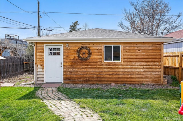 view of outbuilding with a fenced backyard and an outdoor structure