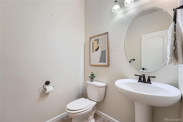 bathroom with sink and toilet