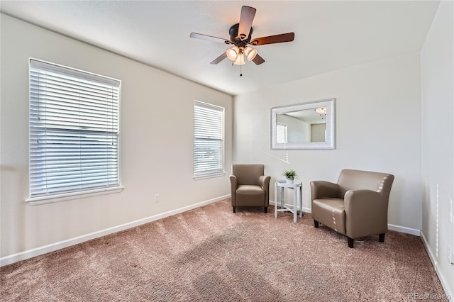 sitting room featuring carpet flooring and ceiling fan