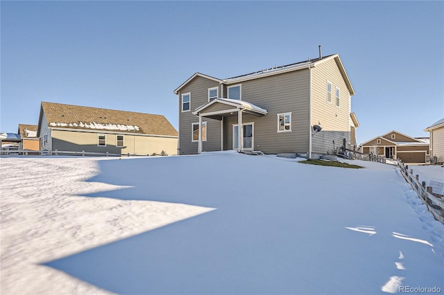 view of snow covered house