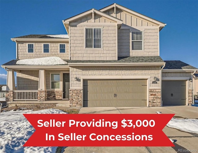 view of front of property featuring stone siding, an attached garage, a porch, and driveway