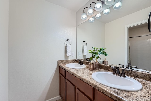 bathroom with double vanity and a sink