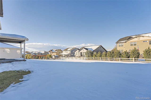 view of yard featuring fence and a residential view