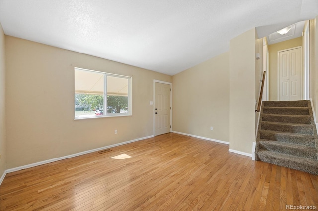 spare room with light wood-type flooring