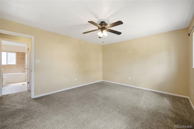 empty room featuring ceiling fan and carpet flooring