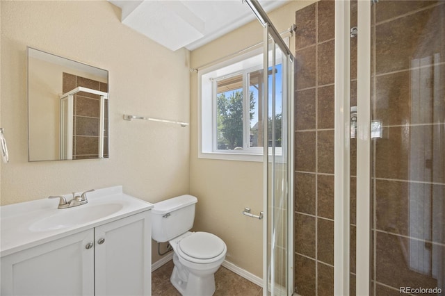 bathroom with a shower with shower door, vanity, and toilet