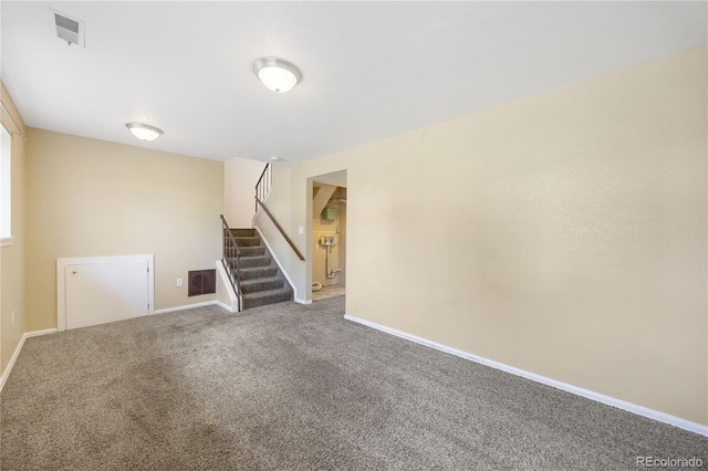 unfurnished room with carpet flooring