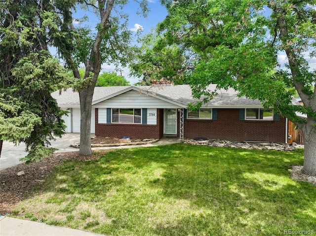 3784 Swadley St, Wheat Ridge, CO 80033 - single story home featuring a garage, brick siding, a front lawn, and concrete driveway