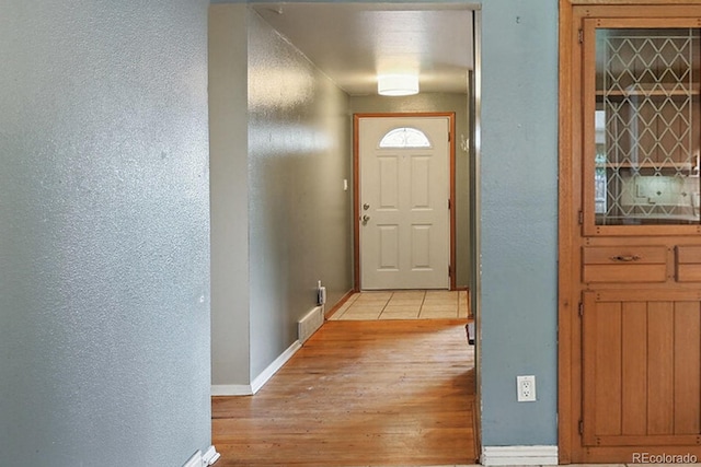 3784 Swadley St, Wheat Ridge, CO 80033 - entryway featuring a textured wall and light wood-style floors