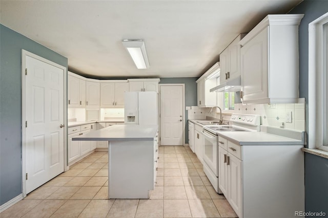 3784 Swadley St, Wheat Ridge, CO 80033 - kitchen featuring white appliances, a kitchen island, decorative backsplash, and white cabinets