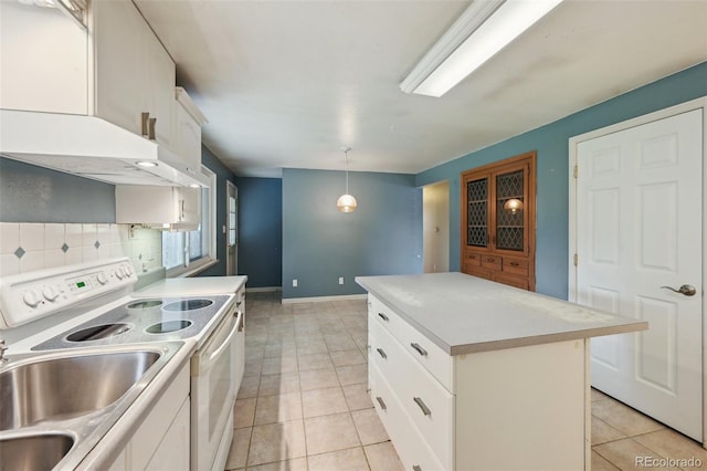 3784 Swadley St, Wheat Ridge, CO 80033 - kitchen featuring white range with electric stovetop, a center island, light tile patterned floors, light countertops, and decorative light fixtures