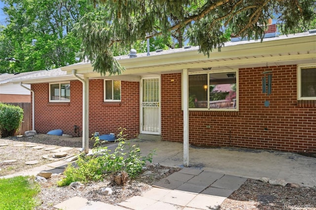 3784 Swadley St, Wheat Ridge, CO 80033 - view of front of property with brick siding and a patio area
