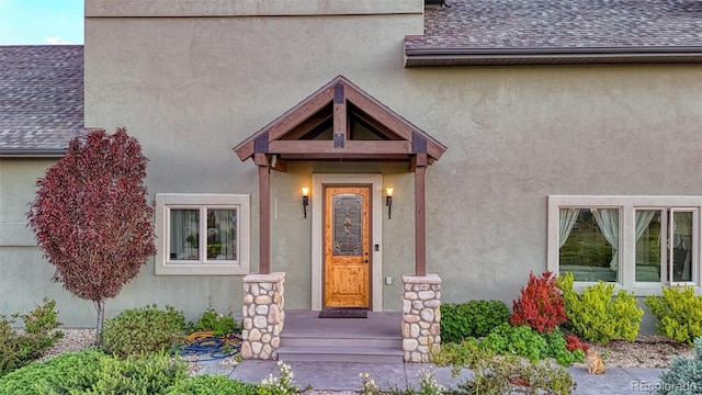 10757 Vista Farms Ct, Salida, CO 81201 - entrance to property featuring stucco siding and roof with shingles