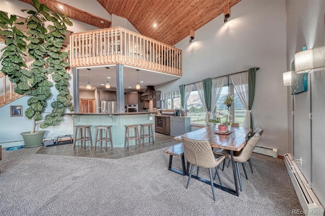 10757 Vista Farms Ct, Salida, CO 81201 - dining room featuring a baseboard radiator, high vaulted ceiling, a baseboard heating unit, wood ceiling, and carpet
