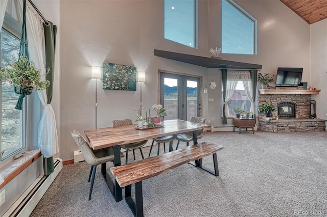10757 Vista Farms Ct, Salida, CO 81201 - carpeted dining room with baseboard heating, healthy amount of natural light, high vaulted ceiling, french doors, and a stone fireplace