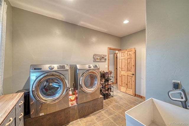10757 Vista Farms Ct, Salida, CO 81201 - laundry area featuring washer and clothes dryer, cabinet space, and recessed lighting