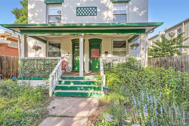 1612 N High St, Denver, CO 80218 - view of front of house featuring brick siding and covered porch