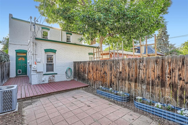1612 N High St, Denver, CO 80218 - fenced backyard featuring a garden, a patio area, and a deck