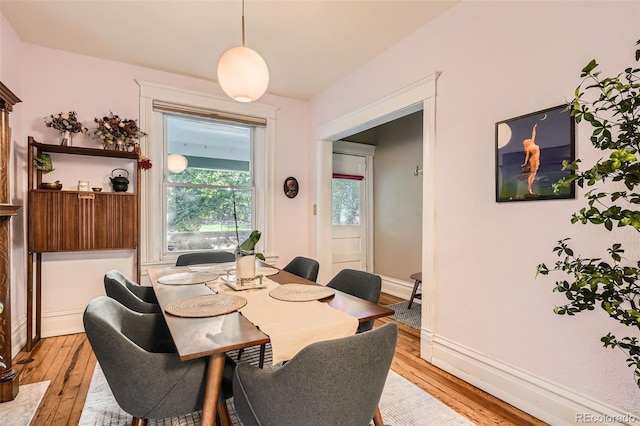 1612 N High St, Denver, CO 80218 - dining space featuring light wood-type flooring and baseboards