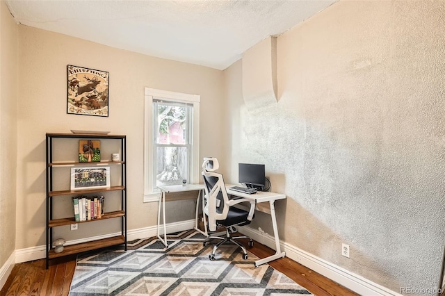 1612 N High St, Denver, CO 80218 - home office featuring wood finished floors and baseboards