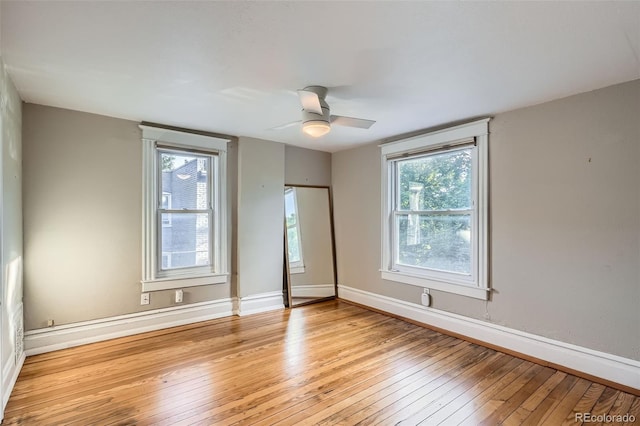 1612 N High St, Denver, CO 80218 - unfurnished bedroom featuring light wood-style flooring and a ceiling fan