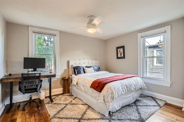 1612 N High St, Denver, CO 80218 - bedroom with hardwood / wood-style flooring, an office area, and a ceiling fan