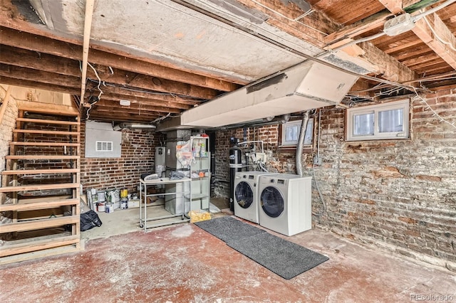 1612 N High St, Denver, CO 80218 - unfinished below grade area featuring washing machine and dryer and brick wall