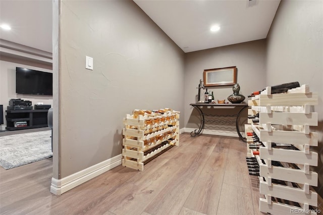 17490 W 67th Ave, Arvada, CO 80007 - wine area with light wood-style floors, recessed lighting, and baseboards