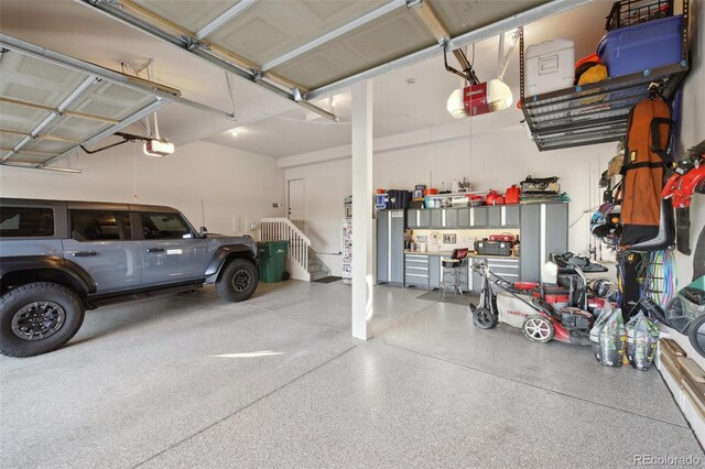 17490 W 67th Ave, Arvada, CO 80007 - garage featuring a garage door opener