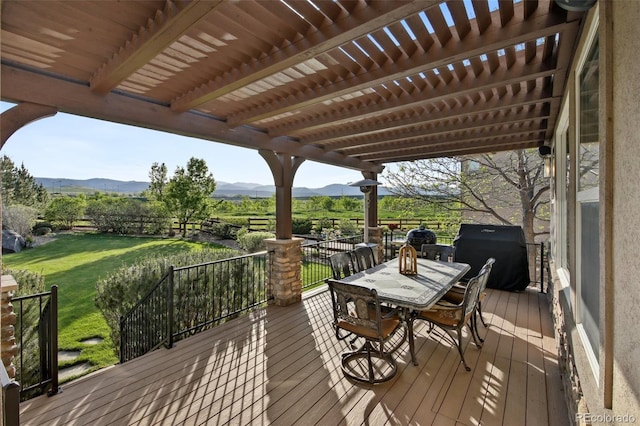 17490 W 67th Ave, Arvada, CO 80007 - wooden terrace with a mountain view, grilling area, a yard, and outdoor dining area