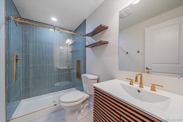 bathroom featuring toilet, vanity, tile patterned floors, and an enclosed shower