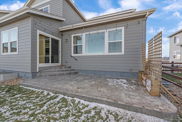 rear view of property with a patio area