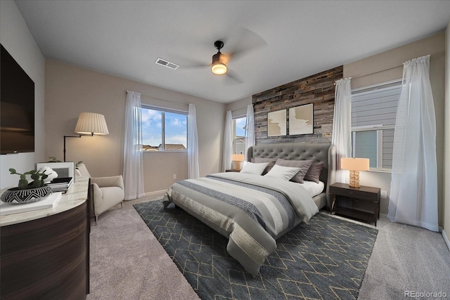 bedroom featuring ceiling fan and dark colored carpet