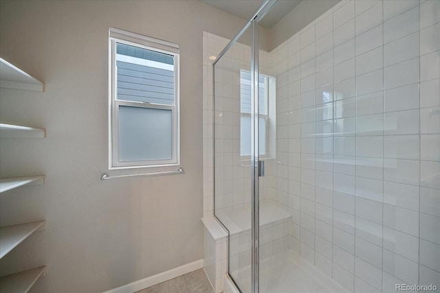 bathroom with a shower with shower door