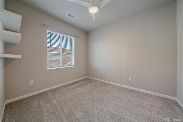 carpeted empty room with ceiling fan