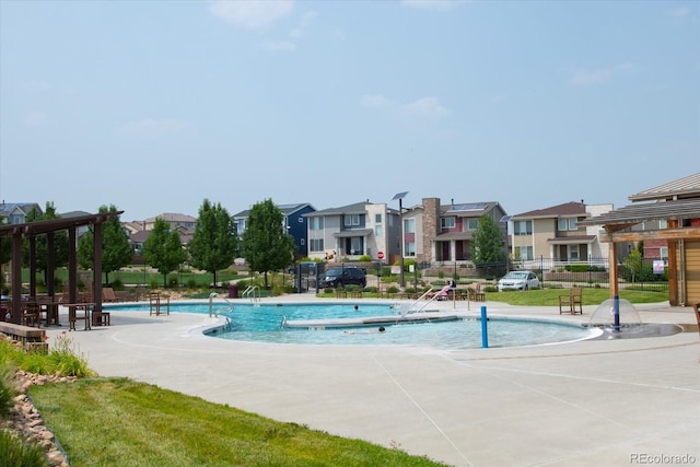 view of pool featuring a patio