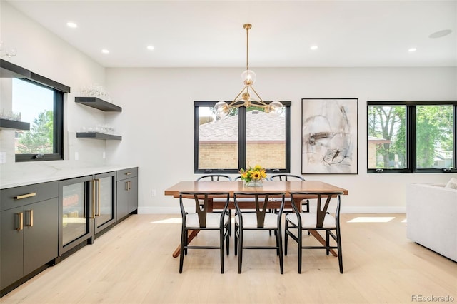 1462 S Vine St, Denver, CO 80210 - dining area featuring beverage cooler, light wood-style floors, healthy amount of natural light, and recessed lighting