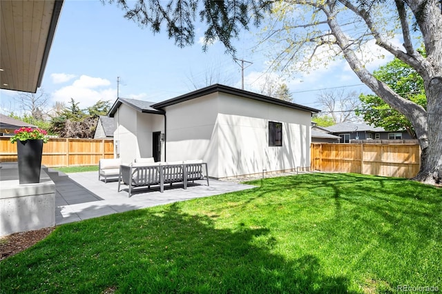 1462 S Vine St, Denver, CO 80210 - rear view of property with a fenced backyard, a patio, outdoor lounge area, and stucco siding